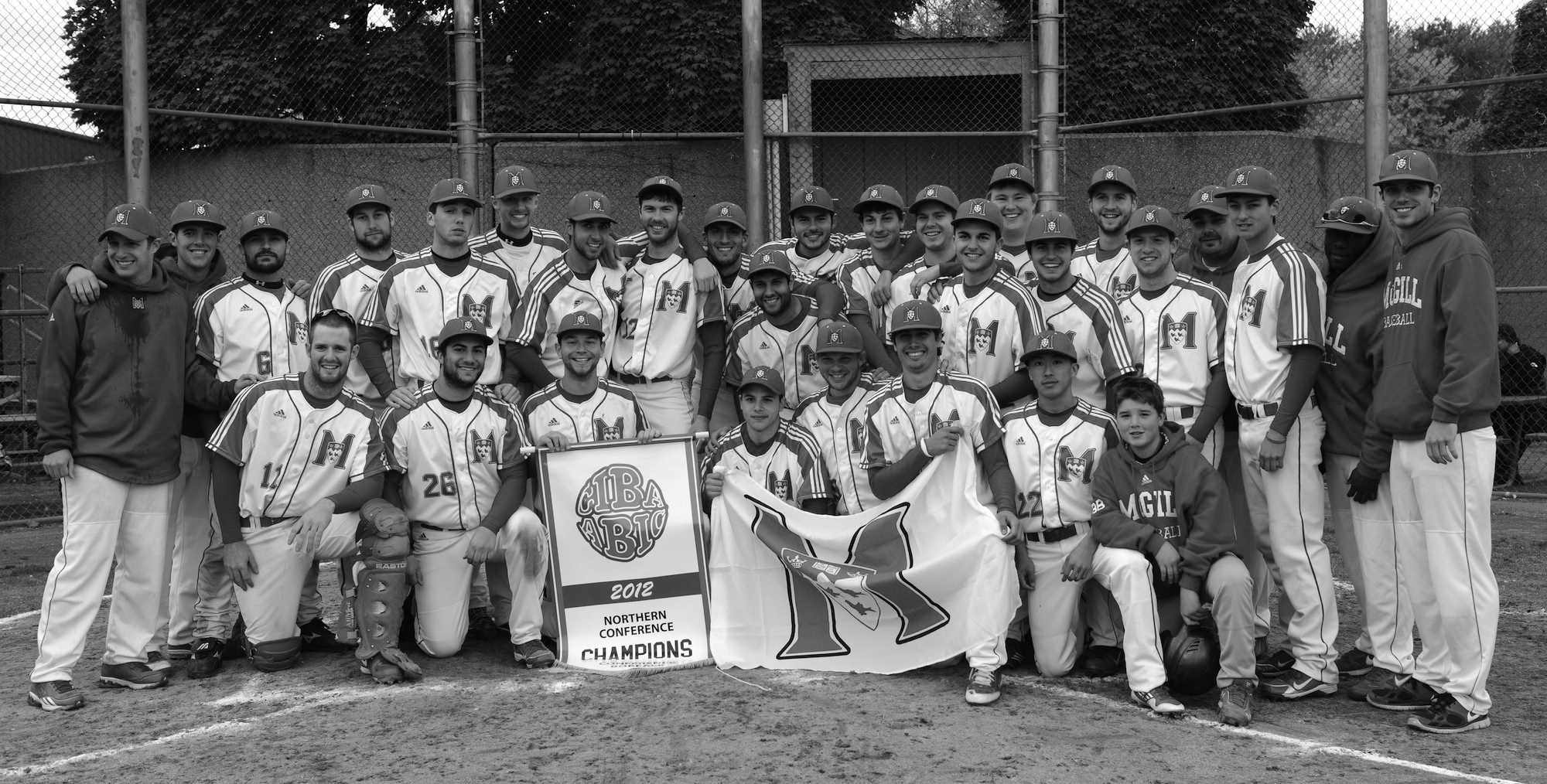 The Redmen celebrate their Northern Conference title. (Benjamin Gordon / McGill Tribune)