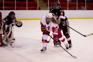 Fourth-year forward Chelsey Saunders fights for position in front of the net. (Michael Paolucci / McGill Tribune)