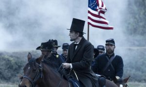 Lincoln (Daniel Day-Lewis) surveys the ravages of war. (filmofilia.com)