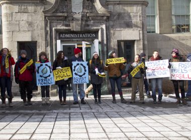 Divest McGill members chant in James Square. (Luke Orlando / McGill Tribune)