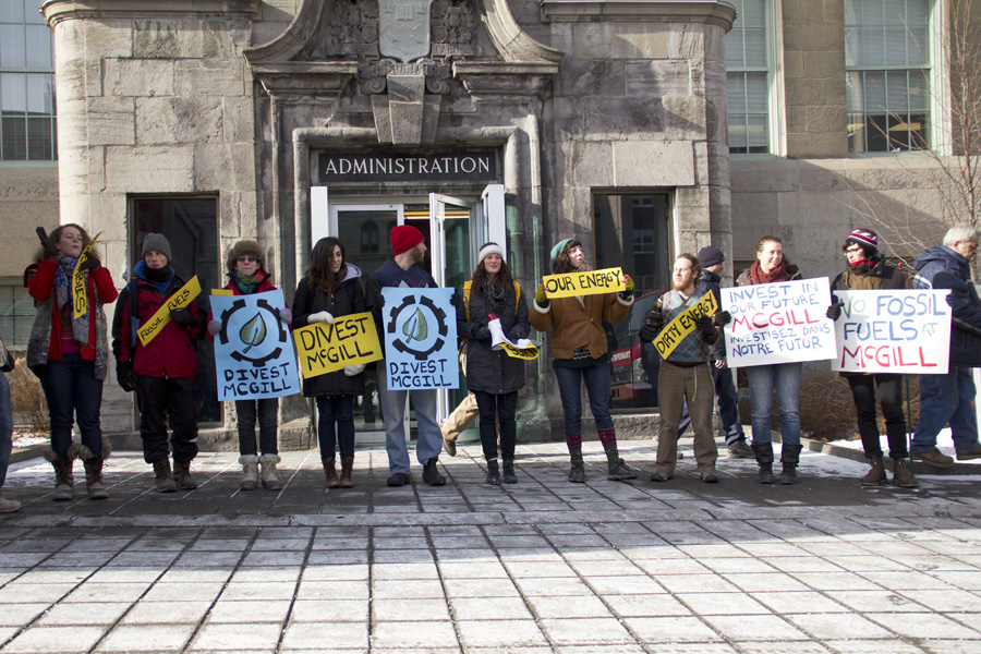 Divest McGill members chant in James Square. (Luke Orlando / McGill Tribune)