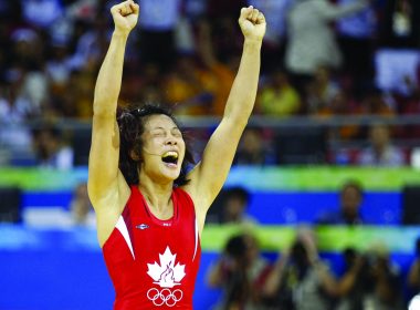 Carol Huynh celebrates a gold medal. (vancouverobserver.com)