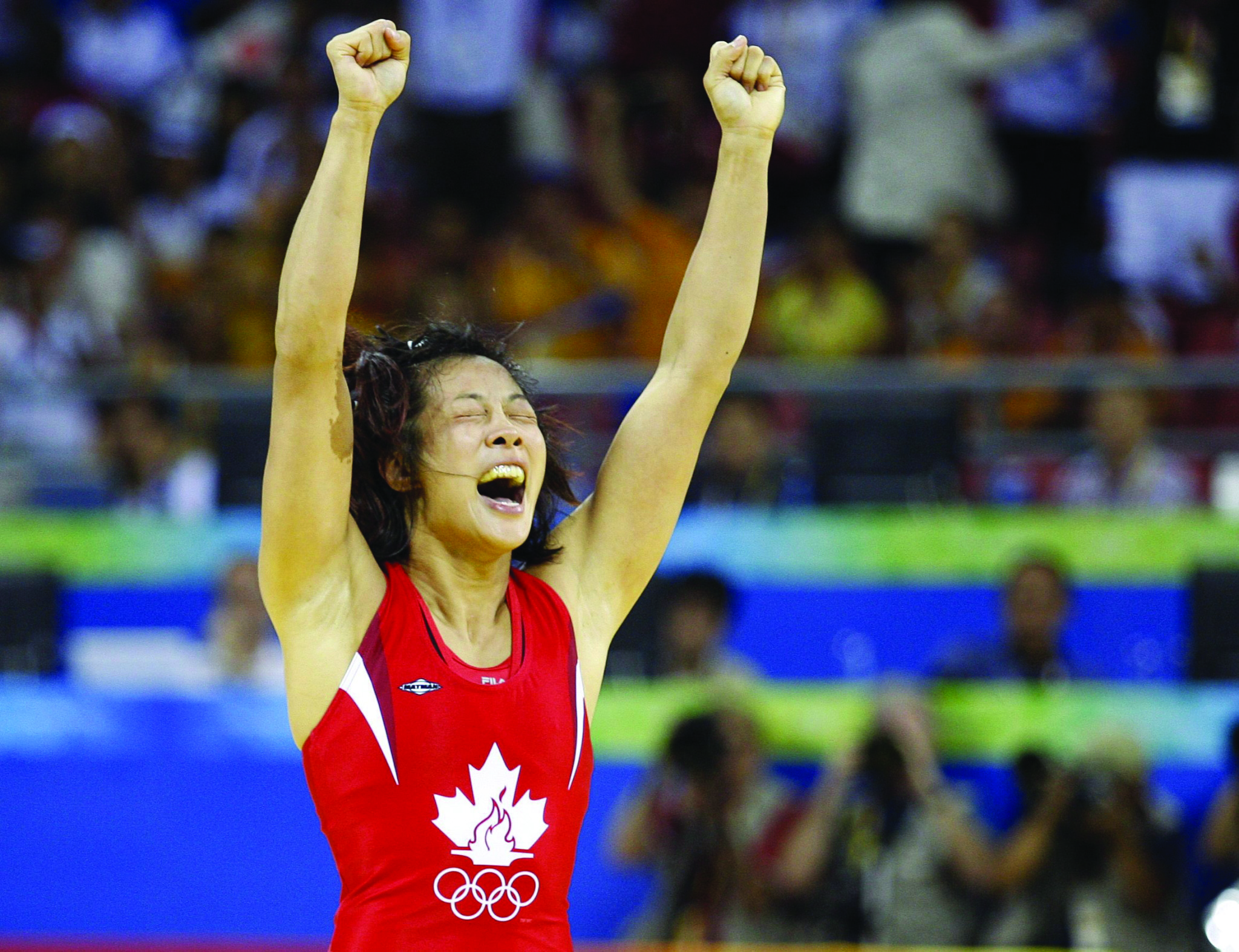 Carol Huynh celebrates a gold medal. (vancouverobserver.com)