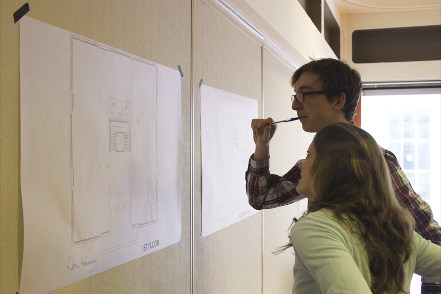 Students draw their ideas for new student space on SSMU building floor plans. (Remi Lu / McGill Tirbune)
